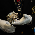 Silver Rose in gloved hands Silver Rose in gloved hands